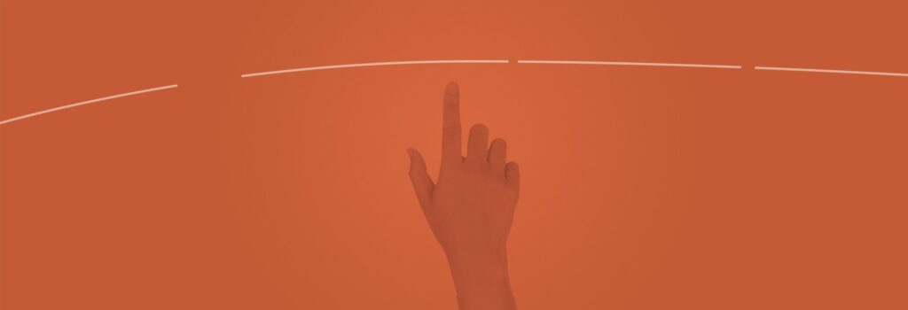 A imagem possui um filtro laranja e mostra uma mão direita branca sinalizando um clique, com os dedos polegar e indicador para cima e os demais fechados.